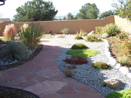 Courtyard garden with native perennials, drip irrigation system and flagstone walkways.